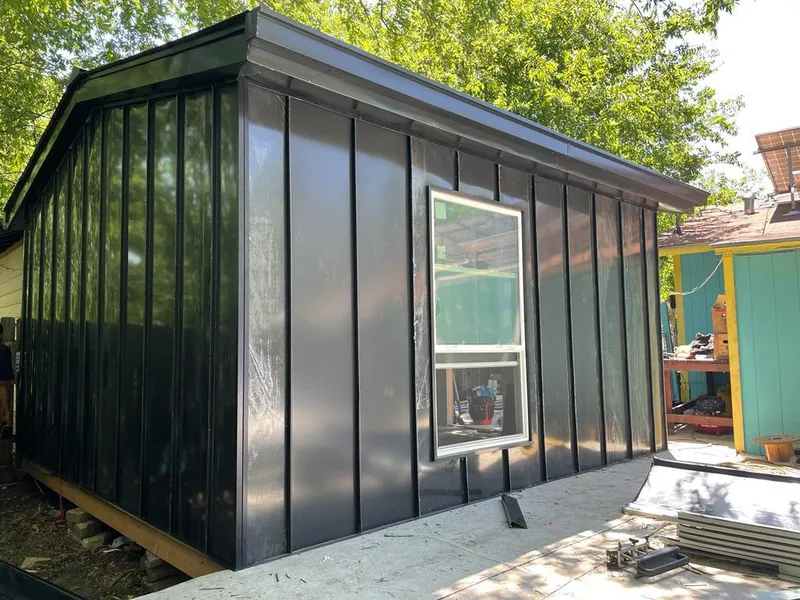 Black standing seam metal wall panels for Roof Inspection in DuBois